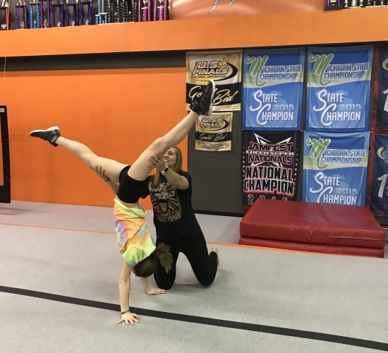 High School Cheer Tumbling student with instructor