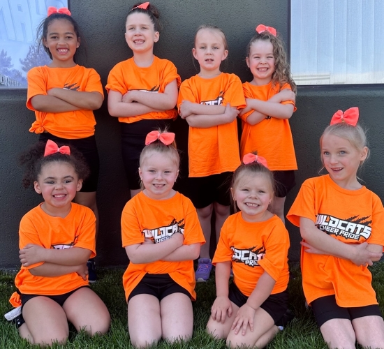 Cheerleaders in orange shirts