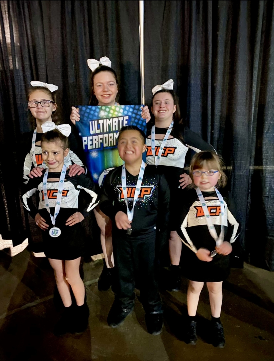 Cheerleaders in Black and orange uniforms